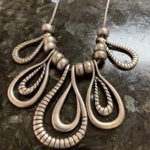 Peter Nygard | Jewelry | Nygard Silver Tone Graduated Loop Pendant ...